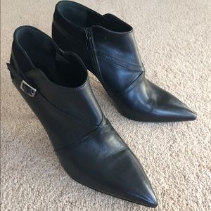 Pointy toe leather booties.